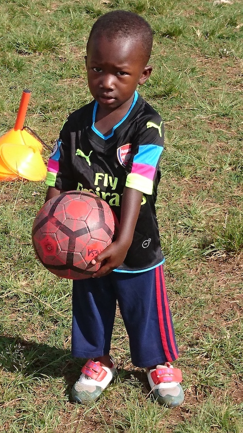 A young Kampala Galaxy Soccer Academy player